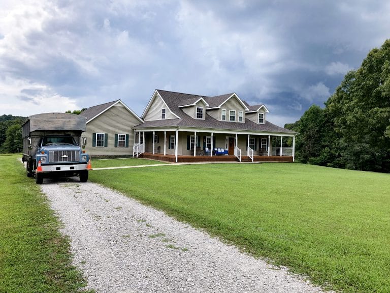 Dark clouds gather behind this home, but with the new shingles, the house will stay dry