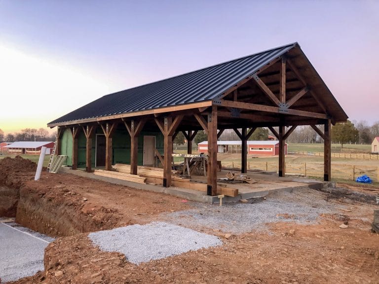 Timber frame building with standing seam metal