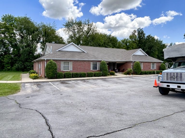 Fresh-looking building after the shingles got replaced by Nate-O Roofing
